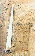 The building's natural air conditioning system consists of 15" diameter PVC irrigation pipes buried deep in the cool soil.